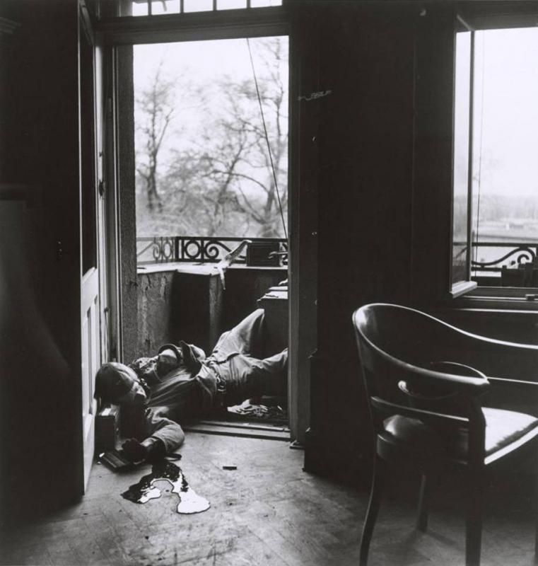 Photos by Robert Capa, American soldier killed by a German sniper.