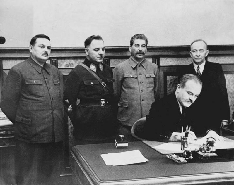 Vyacheslav Molotov signing a pact with Soviet-puppet state Finnish Democratic Republic