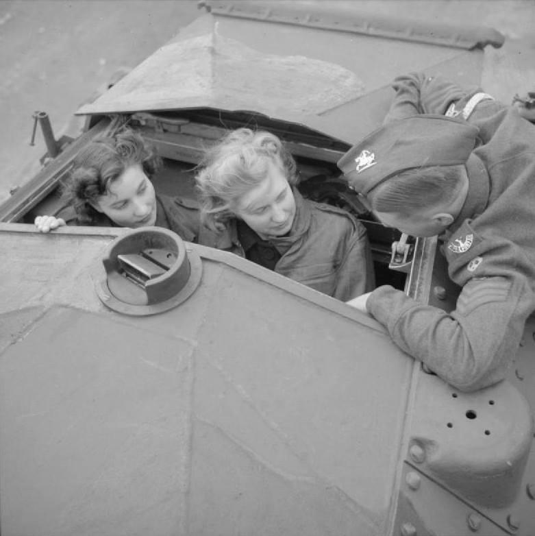 Two female factory workers the turret of a Covenanter tank