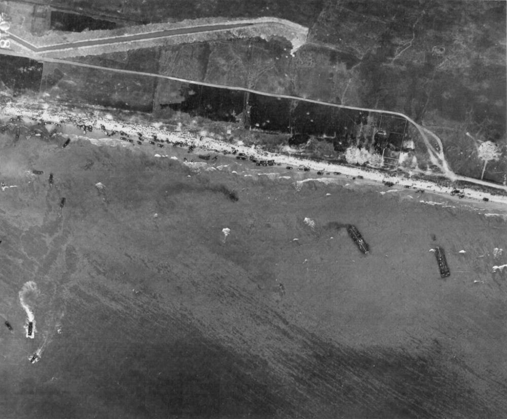 Aerial view of Omaha Beach showing landing of two infantry regiments 18th and 115th vehicles and landing craft