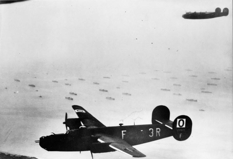 Consolidated B 24H Liberators flying over part of the Allied invasion fleet gathered off the Normandy coast