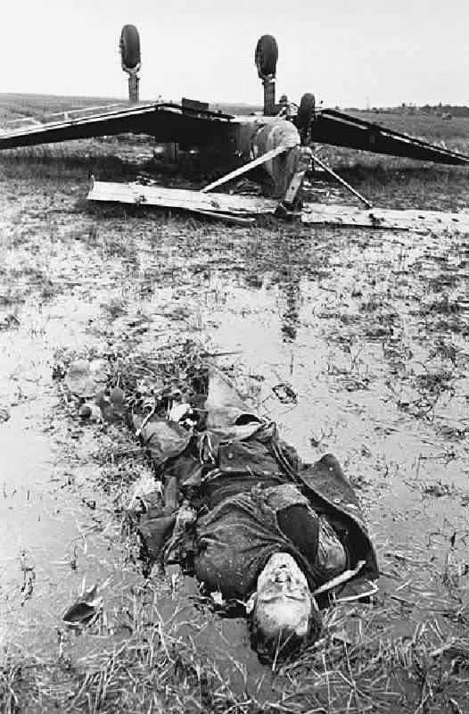A Stuka pilot lies dead near his shot down plane. Russia, date unknown.