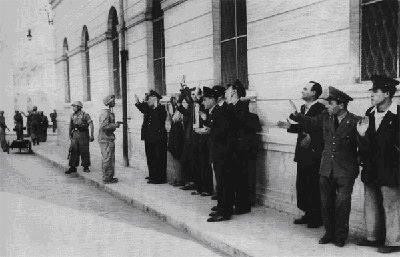 Paratroopers of the Hermann Goering div. shot 10 traffic policemen and two street sweepers