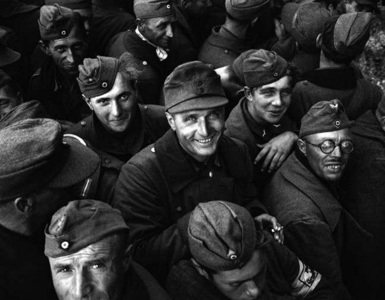 German prisoners file past the Town Hall at Cherbourg