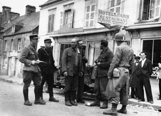 Two German soldiers surrendered to a solitary American soldier in Barneville