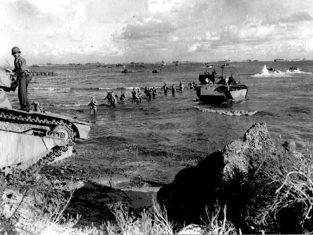 Marines land on Tinian island in the face of light Japanese opposition