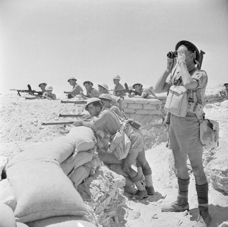 Infantry manning a sandbagged defensive position near El Alamein
