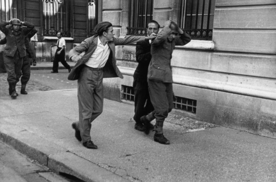 Photo by Robert Capa, French civilian unable to contain his wrath
